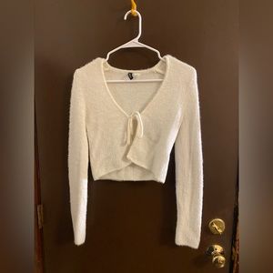 White Sweater top, ties in the front so best place on another shirt